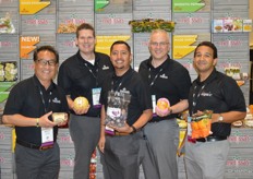 The team from Melissa's, showing a variety of specialty items. Ranging from CleanSnax to a Charentais melon from the Dominican Republic to purple Brussels sprouts, a tree-ripened Haden mango from Mexico and Ojai Pixie tangerines.